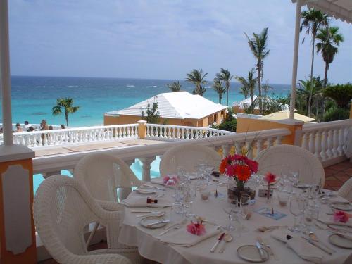 a table set up on the balcony of a resort at Coco Reef Bermuda in Mount Pleasant