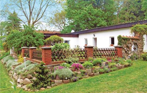 a garden in front of a house with plants at 2 Bedroom Awesome Home In Rubkow in Rubkow