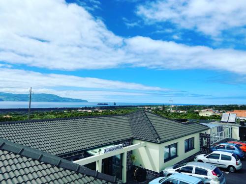 a view of a building with cars parked in a parking lot at AL Novavista by A5P in Madalena