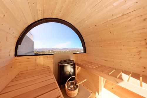 an inside view of a wooden cabin with a window at Crystal Besso Shirahama in Shirahama