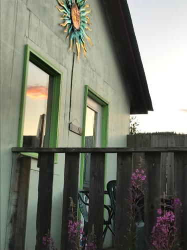 a building with a sunflower decoration on the side of it at Meadow Suites in Wells in Barkerville