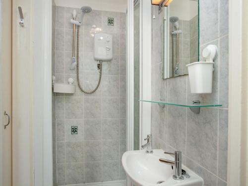 a bathroom with a sink and a shower at Apartment One - Uk39832 in Paignton