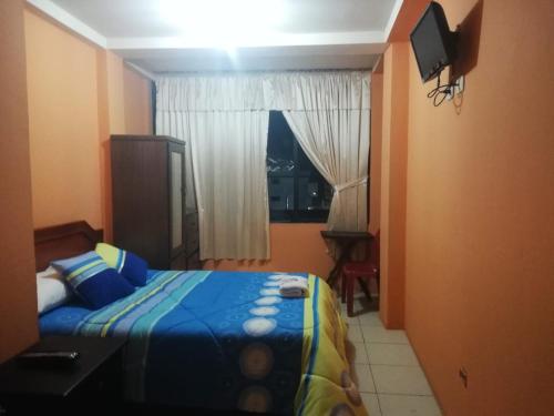 Ein Bett oder Betten in einem Zimmer der Unterkunft Centro Macas