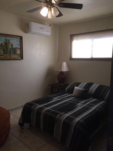 Postel nebo postele na pokoji v ubytování Apartment Downtown Cananea