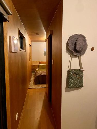 a hallway leading to a room with a bed at Aquila Eco Retreat in Richmond
