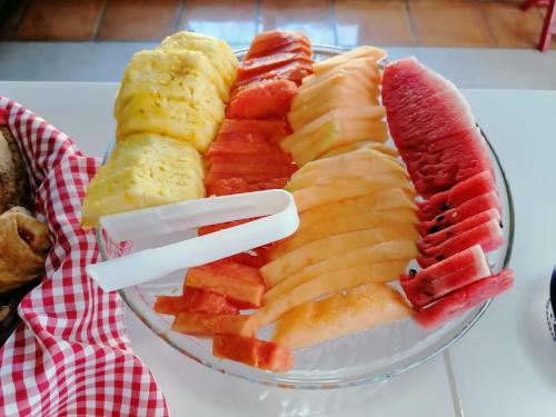 a plate of sliced fruit on a table at Hotel La Lejona in San Miguel de Allende