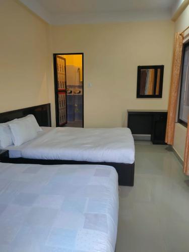 Postel nebo postele na pokoji v ubytování Kavre Guest House