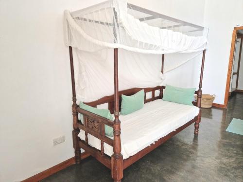 Een bed of bedden in een kamer bij Archipelago Waterfront