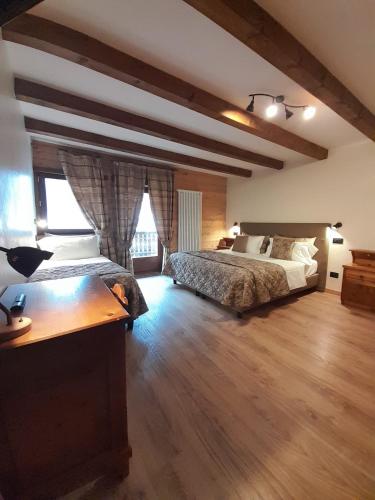 Postel nebo postele na pokoji v ubytování Hotel Astoria