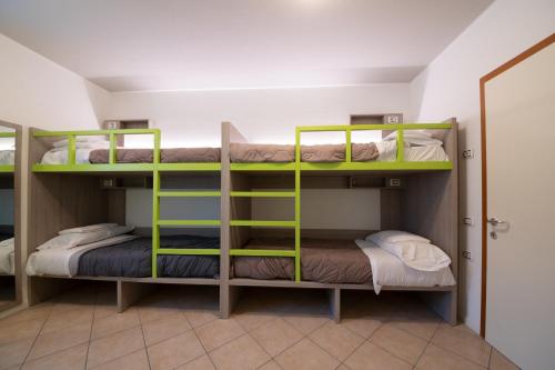 a bunk bed room with two bunk beds in it at Ostello Città di Rovereto in Rovereto