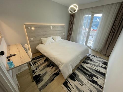 Postel nebo postele na pokoji v ubytování Hotel Anthousa