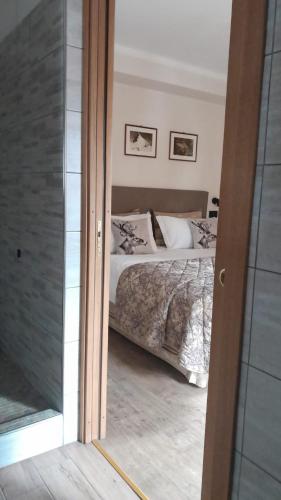 Postel nebo postele na pokoji v ubytování Hotel Astoria