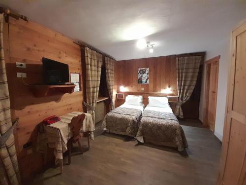 Postel nebo postele na pokoji v ubytování Hotel Astoria
