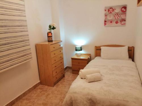 Postel nebo postele na pokoji v ubytování La Estrella de Alicante