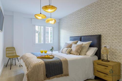 Posteľ alebo postele v izbe v ubytovaní Living4Malaga Boho Chic Apartment