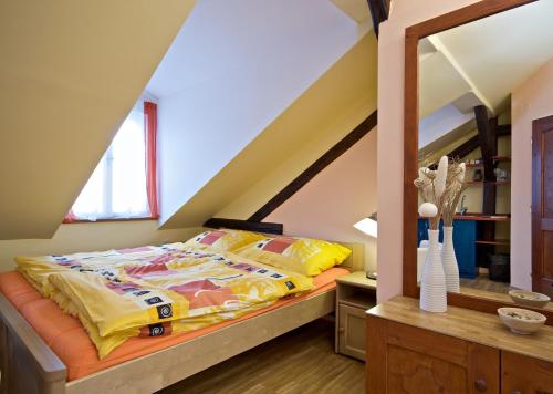 a bedroom with a bed in a attic at Pension Ibérica in Brno