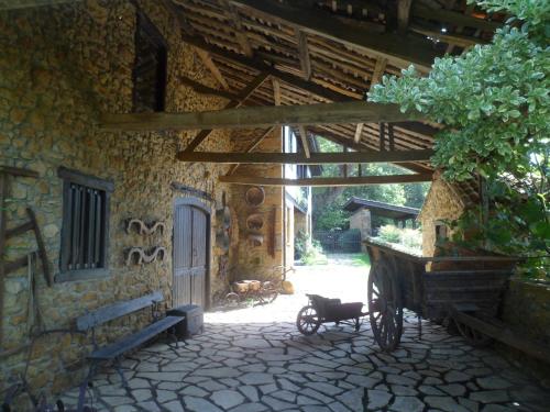 a bike parked in front of a stone building at Casa Rural La Retuerta in Nava