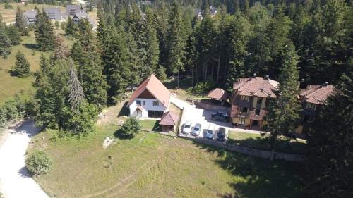 an aerial view of a large house with trees at Vila Ivana in Mitrovac
