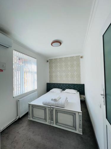 Ένα ή περισσότερα κρεβάτια σε δωμάτιο στο AL-MOTRUDIY
