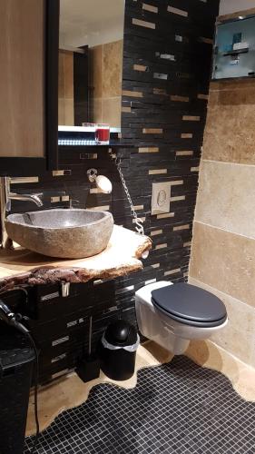 a bathroom with a sink and a toilet at Coup de cœur in Marseille