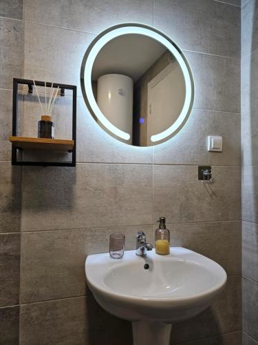 a bathroom with a sink and a mirror at Mimi in Vrnjačka Banja