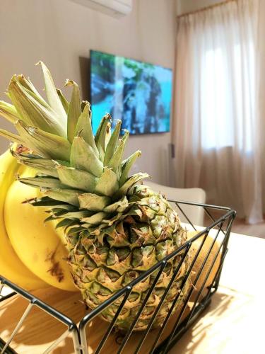 a pineapple and a banana on a table at SITIA CITY CENTER luxury apartment in Sitia