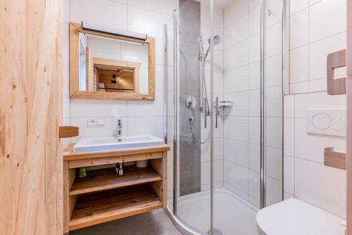 a bathroom with a sink and a shower at Pfefferkornhütte in Warth am Arlberg