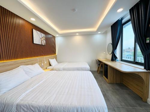 Cama o camas de una habitación en Ngọc Anh Hotel