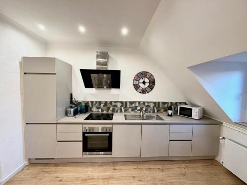 Kuchyň nebo kuchyňský kout v ubytování Stadthaus Apartment Bachperle