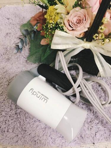 a bottle of wine sitting next to a bouquet of flowers at Osaka Glitter 3 floor whole house 6-10 ppl 5mins walk to station in Osaka