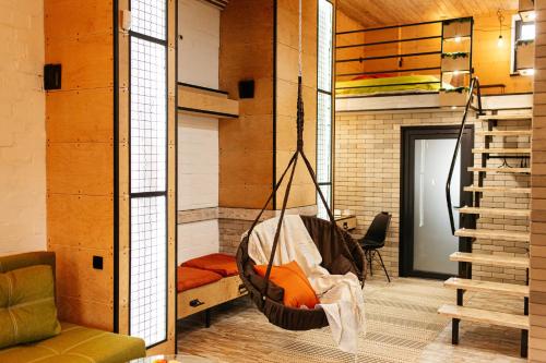 a room with a hammock hanging from a wall at loft apartments OLD MILL in Sarny