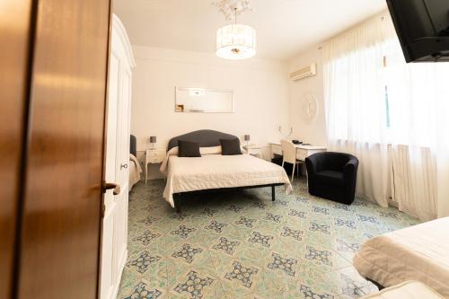 Una cama o camas en una habitación de Hotel Miramare