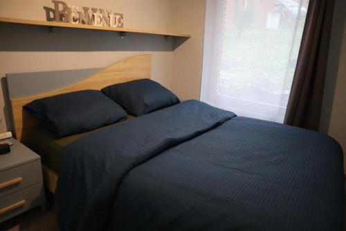 Llit o llits en una habitació de Chalet Kiwi