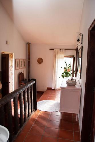 a staircase leading to a room with a window at Casa Senhor da Ponte in Mondim de Basto