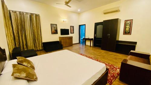 Katil atau katil-katil dalam bilik di Spring Gardens and Farmstay