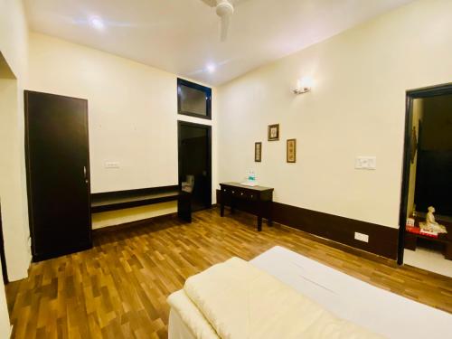 Katil atau katil-katil dalam bilik di Spring Gardens and Farmstay