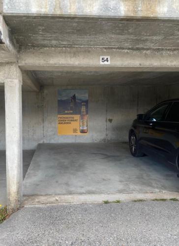 a parking garage with a car parked in it at Chalet Baumfuchs direkt an der Talabfahrt Belalp in Blatten bei Naters