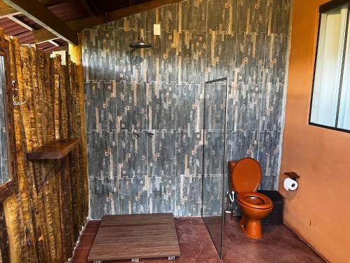 a bathroom with a shower and a toilet in it at Rancho Aroeira in Sao Jorge