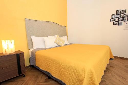 Postel nebo postele na pokoji v ubytování Hotel Universidad
