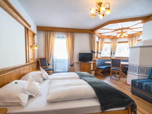 Postel nebo postele na pokoji v ubytování Garni Hotel Rosengarten B&B