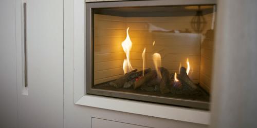 a fireplace is shown with a fire in it at Suite San Martino in Martina Franca