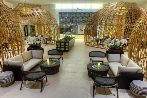a lobby with chairs and tables in a store at Kandaya Resort in Daanbantayan