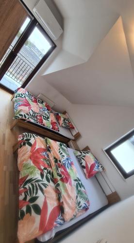 three beds in a room with a window at Dom pod Wroclawiem19 in Domasław