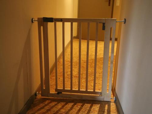 a stairway with a gate in a room at Cosy Authentic Farmhouse - LaComte5 in Vielsalm