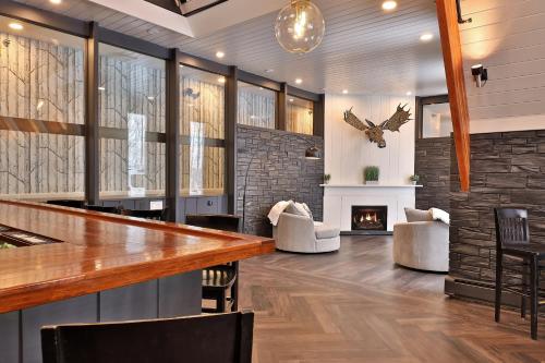 a lobby with a bar and a fireplace at The Birch Ridge- European Room #8 - King Suite in Killington, Vermont, Hot Tub, home in Killington