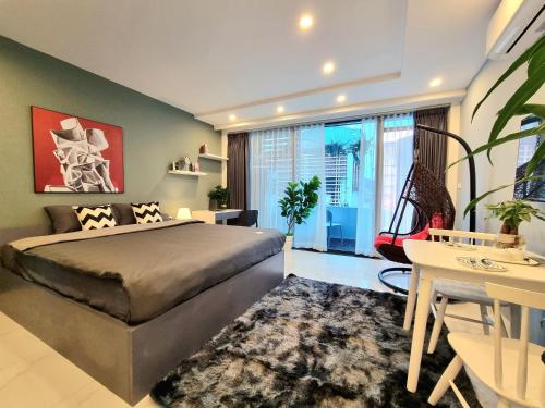 a bedroom with a bed and a large window at LaHomestay Hồng Hà in Hanoi