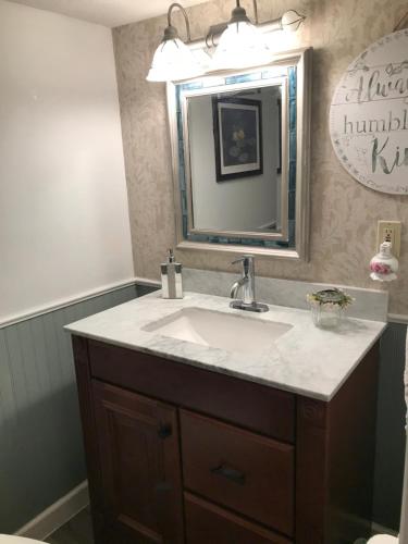 a bathroom with a sink and a mirror at Hope Bed and Breakfast in Canton