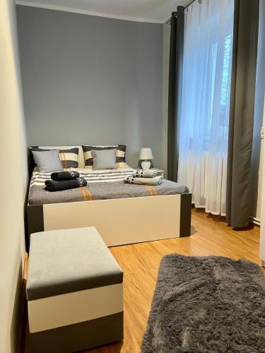 two beds in a room with a room with two at Apartament pod Góralką in Polanica-Zdrój