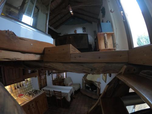 an overhead view of a room with a large wooden table at Sa domu 'eccia in Urzulei