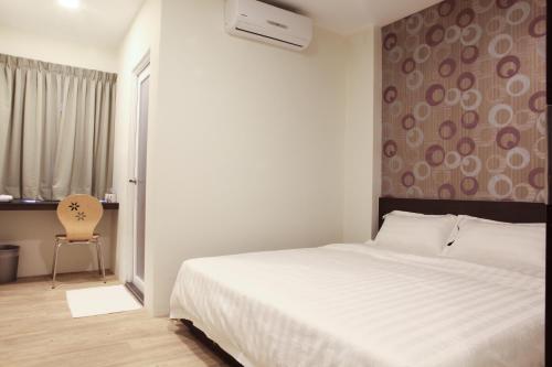 Postel nebo postele na pokoji v ubytování Hotel Mezzo